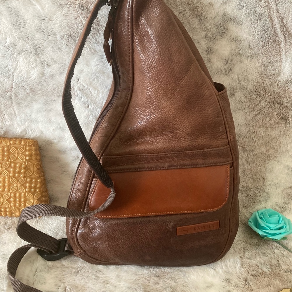 Preloved Traveler  Brand L.L Bean. Colors dark brown and a light brown